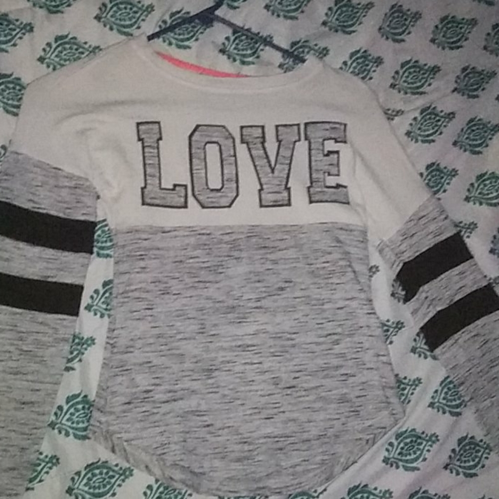 A grey and white long sleeve shirt.